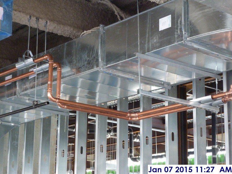 Installing copper piping at the 4th floor Facing West'